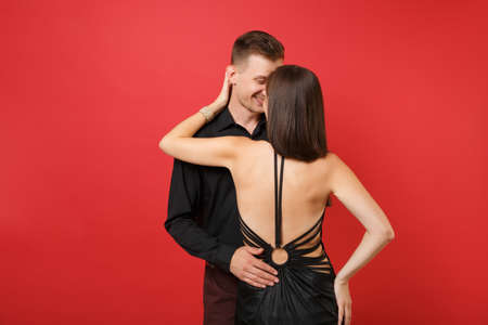 Fashionable young couple in black clothes shirt dress celebrating birthday holiday party isolated on...