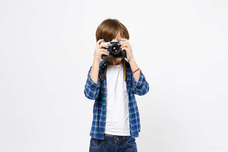 Fun little kid boy in blue t-shirt hold retro vintage photo camera, doing photo shot isolated on...