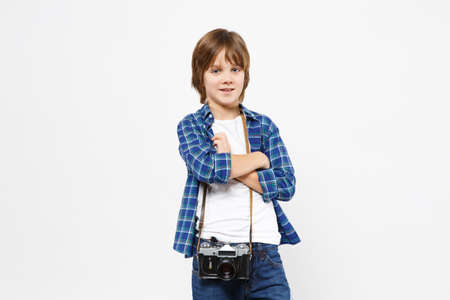 Fun little kid boy in blue t-shirt hold retro vintage photo camera, doing photo shot isolated on...