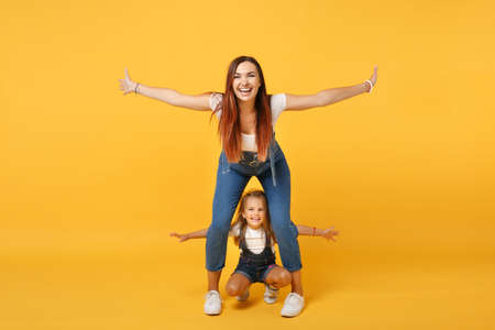 Woman in light clothes have fun with cute child baby girl 4-5 years old. Mommy little kid daughter...