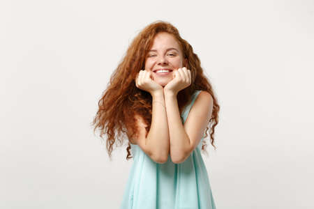 Young pretty joyful redhead woman girl in casual light clothes posing isolated on white background...