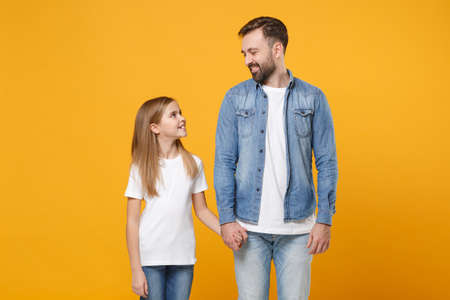 Bearded man in casual clothes have fun with child baby girl. Father little kid daughter isolated on...
