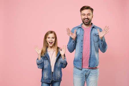 Excited bearded man in casual clothes with child baby girl. Father little kid daughter isolated on pastel pink background.の写真素材