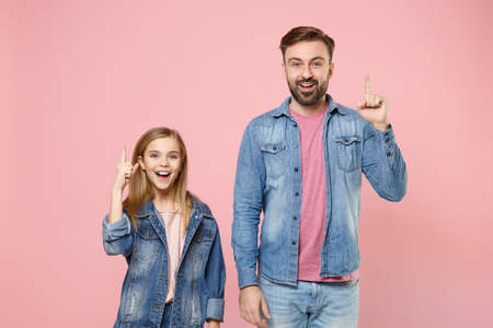 Excited bearded man in casual clothes with child baby girl. Father little kid daughter isolated on pastel pink background.の写真素材