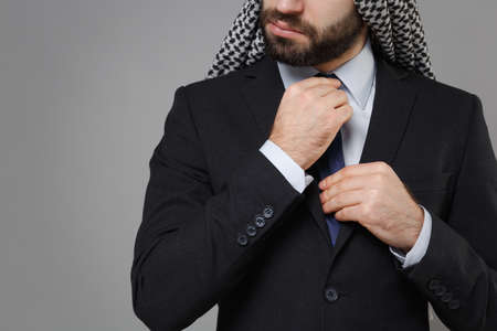 Cropped image of bearded arabian muslim businessman in keffiyeh kafiya ring igal agal classic black...