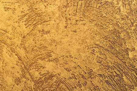 3D texture of gold color. Stylistic surface texture of a yellow metallic wall