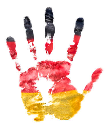 The imprint of the left hand in the colors of the German flag, a print with gouacheの写真素材