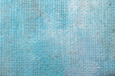 Rough canvas texture in blue tones of oil paint