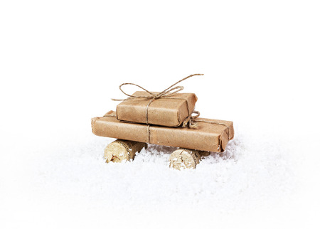 Stylized car and gift box as a Christmas gift on a white backgroundの写真素材