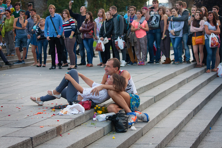 UKRAINE, KIEV - September 11,2013: Homeless couple watching a concert during mass submission to the Independence Squareのeditorial素材