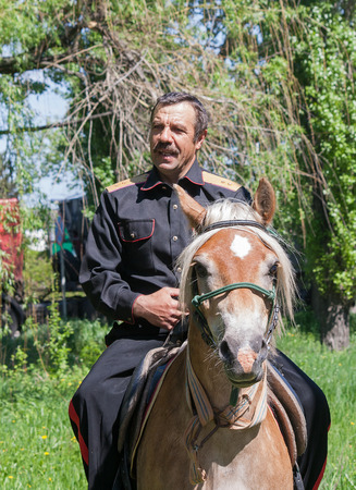 Makeevka, Ukraine - May, 7, 2014: Cossack in uniform on horsebackのeditorial素材