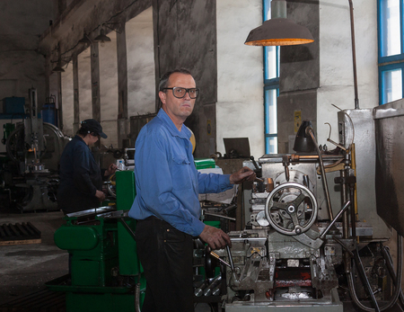 Ukraine, Anthracite - May 15, 2013: Turner in the workplace. Antratsitovsky repair and engineering...