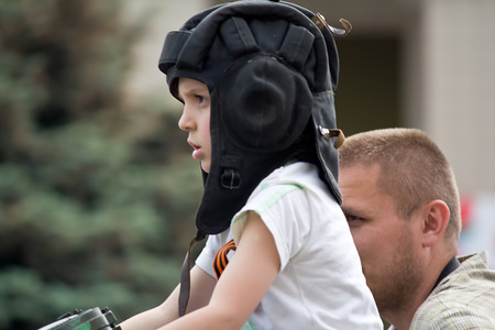 Makeevka, Ukraine - May, 9, 2012: A boy wearing a helmet at the parade in honor of the anniversary of the victory over fascismのeditorial素材