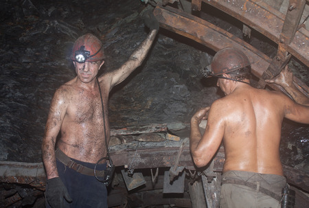Novogrodovka, Ukraine - January, 18, 2013: Miners construct overlap at the coal face at a depth of 800 meters. The mine "1/3 Novogrodovskaya"のeditorial素材