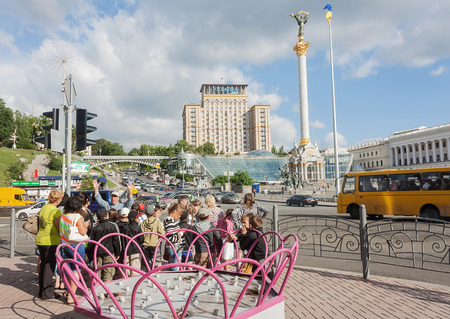 UKRAINE, KIEV - May 27,2013: Children and guide during a tour at the Independence Squareのeditorial素材