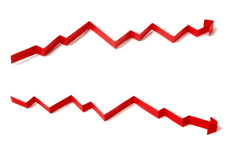 Red rising and  falling arrow on isolated white backgroundの写真素材