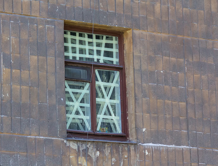 Orthodox icon on the window crosses in the area to be shelling. Ukraineの写真素材