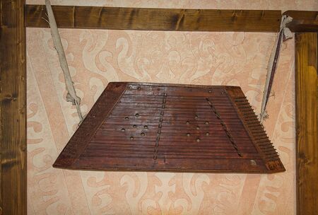 Kokle hanging on the wall, an ancient folk instrument. Ukraineの写真素材