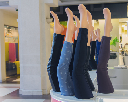 Showcases with leggings in the mall. Fashion and sales