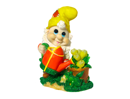 Figurine gnome with a watering can to water the flowers. Isolated on white backgroundの写真素材