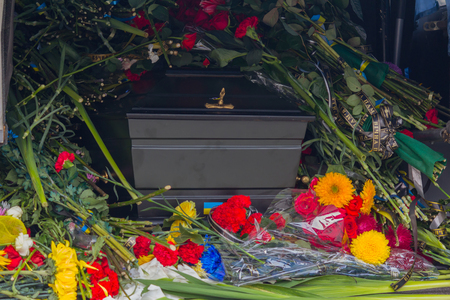 Coffin flowers and Ukrainian symbols. Inscriptions on the tapes "Eternal Memory" in the Ukrainian language. Kiev, Ukraineの写真素材