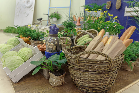 Vegetables and baguettes on a stylized counter. Foodの写真素材