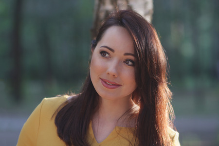 Portrait of a beautiful woman on a forest background. Peopleの写真素材