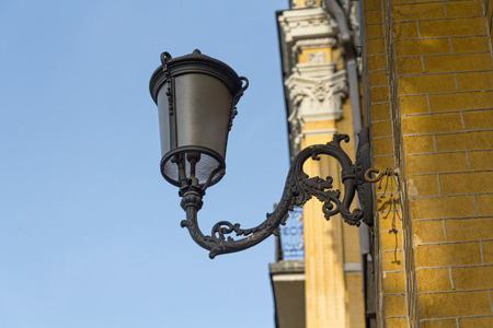 Ancient lantern on the wall of a building. Architectureの写真素材