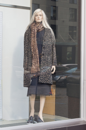 Female mannequin in a shop window. Fashion and saleの写真素材
