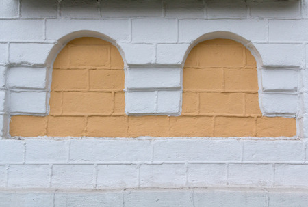 Niche in the form of an arch in the wall of the old church. Architectureの写真素材