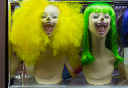 Mannequin with colorful wig and facial accessories. Salesの写真素材