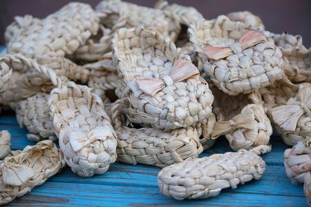 Woven bast shoes on the counter close-up. Craftの写真素材