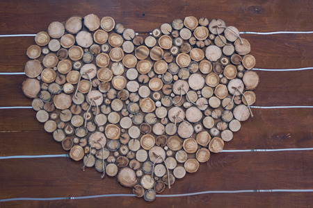 Decoration of the hall in the form of wooden stumps heart. Backgroundsの写真素材