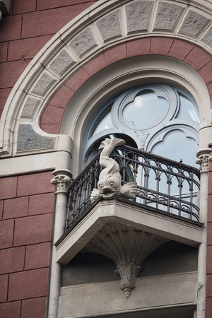 Balcony of the building is in classical style with decoration in the form of fish. Kiev, Ukraineの写真素材