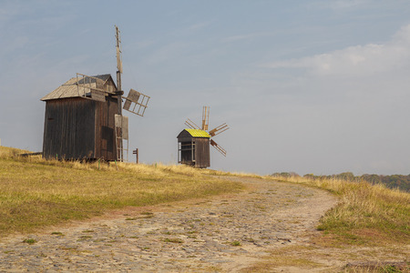 Ancient windmills in the field. Pirogovo, Ukraine