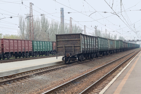 Freight wagons are standing in line at the railway station. Industry