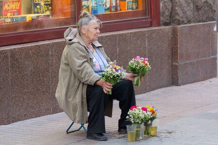 Kiev, Ukraine - June 16, 2016:  Elderly woman sells wild flowers on Khreschatyk Streetのeditorial素材
