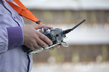 Remote control for sports model in the hands of men. Hobby