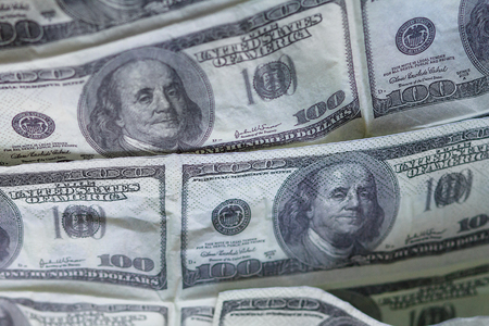 Background of fake dollar bills printed on paperの写真素材