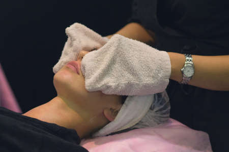 Woman in the salon during cosmetic proceduresの写真素材
