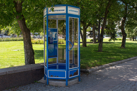 Donetsk, Ukraine - May 17, 2017: Abandoned telephone booth with the Ukrtelecom brand in the center of the cityのeditorial素材