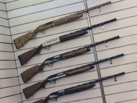 Hunting rifles on the stand of the store. Sales