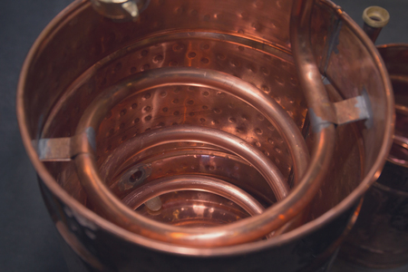 Copper alcohol mashine close up. Industryの写真素材