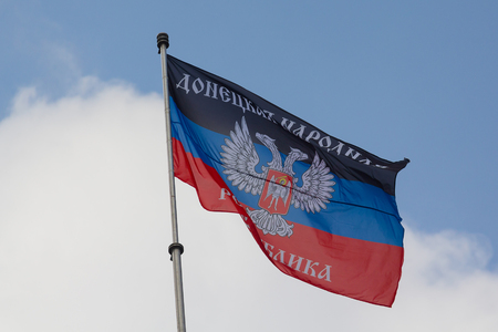 Donetsk, Ukraine - August 27, 2017: Flag of the self-proclaimed Donets People's Republic on the central square of the cityのeditorial素材