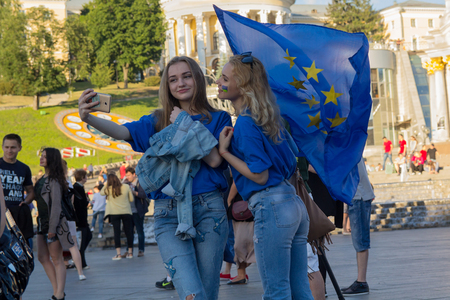 Kiev, Ukraine - June 10, 2017:  Girls with the flag of the European Union on the Independence Square during the celebration of the provision of visa-free regimeのeditorial素材