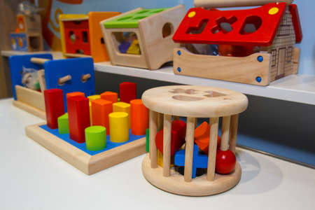 Wooden educational toys on the store shelvesの写真素材