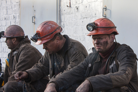 Makeevka, Ukraine - October 30, 2012: Miners of the mine Yasinovskaya-Glubokaya smoke after the robochy shiftのeditorial素材
