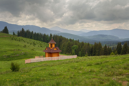 Panoramic view of the year with a wooden chapel. Carpathiansの写真素材