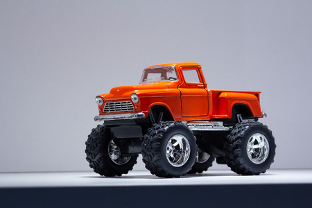 Model of a retro SUV on large wheels. Toys