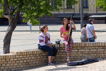 Kiev, Ukraine - June 05, 2018: The girl plays the folk instrument of the bandura on the town squareのeditorial素材